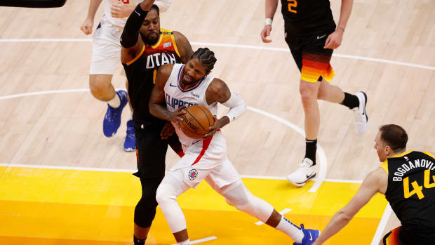Jun 8, 2021; Salt Lake City, Utah, USA; LA Clippers guard Paul George (13) drives to the hoop against Utah Jazz center Derrick Favors (15) in the fourth quarter during game one in the second round of the 2021 NBA Playoffs. at Vivint Arena. Mandatory Credit: Jeffrey Swinger-USA TODAY Sports